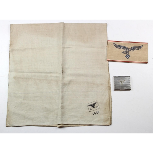 268 - German Luftwaffe cigarette case, an armband and tea towel