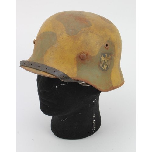 284 - German M35 camo steel helmet, Wehrmacht shield, complete with liner & chin strap, service wear.