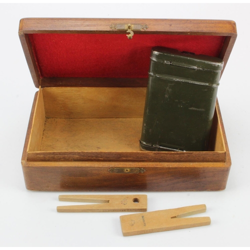 333 - German SS wooden cigarette box and inside 2x SS clothes pegs plus a gun cleaning kit.