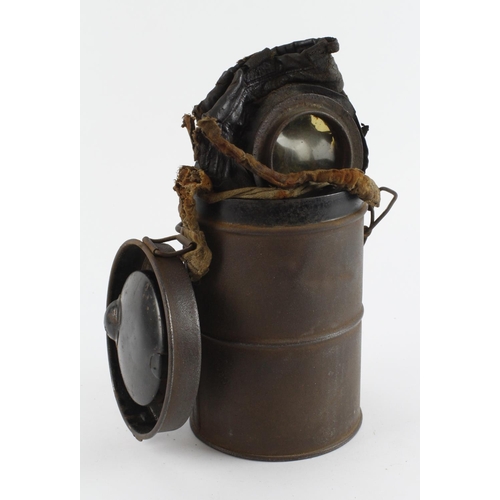 357 - German WW1 gas mask in its original metal case in reasonably good condition but the straps are missi... 