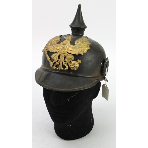 419 - Prussian Ersatz metal body pickelhaube. Remnants of liner. Late war. Earlier brass line eagle plate.