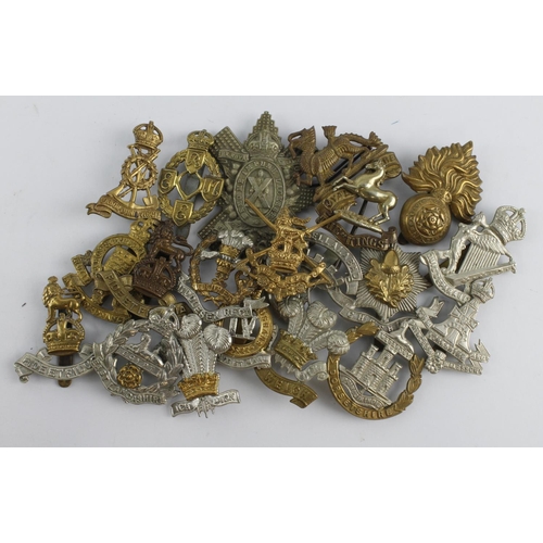 527 - Cap Badges: A good group of 20 different cap badges, mixed periods with no apparent restrikes.