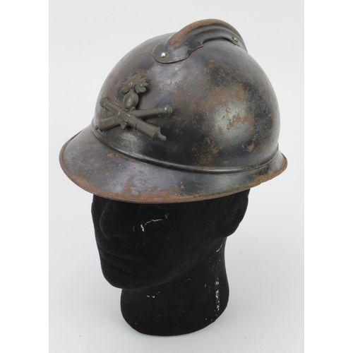 539 - French WW1 Poilu steel helmet, Artillery badge, complete with tatty liner.