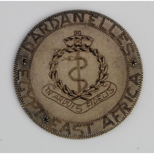 542 - German East Afrika Rupe. Trench art to Royal Army Medical Corps. Dardanelles inscription.