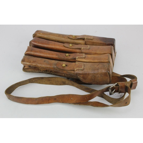 555 - Leather Bandolier with four 'magazine' pouches. Small split to leather noted