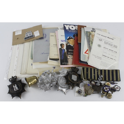 569 - Police interest - to include a selection of old helmet badges, lapel badges, fobs, selection of ephe... 