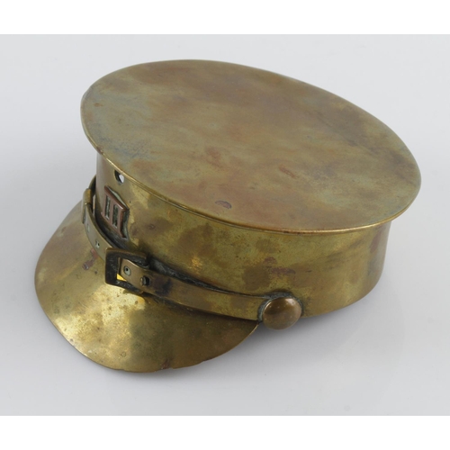 675 - WW1 Trench Art 'British Tommy' peaked cap with a 'III' badge