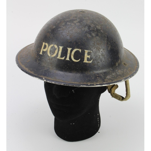 704 - WW2 police steel helmet all complete.