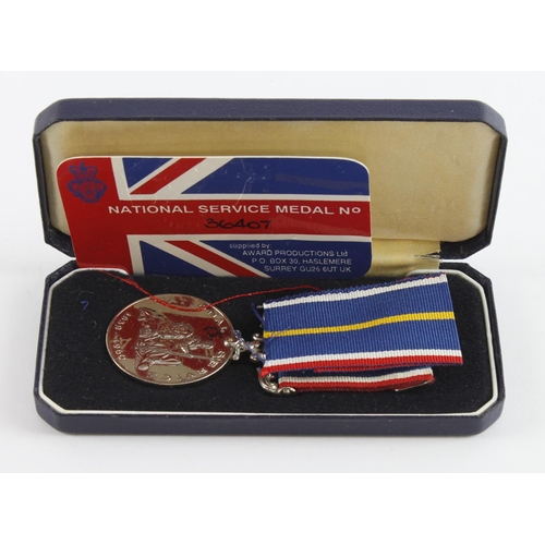 901 - National service medal in original case with award card.