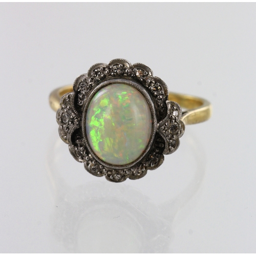 184 - Yellow gold (tests 18ct) diamond and opal cluster ring, one opal oval cabochon measures approx. 10mm... 