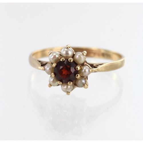 190 - 9ct yellow gold garnet and pearl cluster ring, one garnet measuring 4.5mm, surrounded with eight spl... 