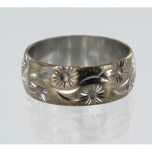 196 - 9ct white gold vintage floral wedding band, width approx. 7mm, finger size N/O, weight 3.9g.