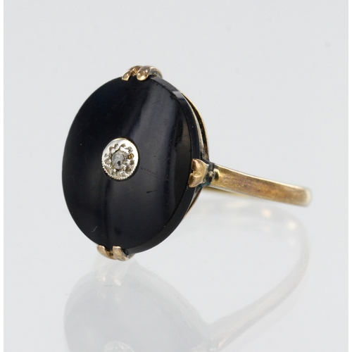 197 - Yellow gold (tests 18ct) diamond and onyx dress ring, oval onyx measures 13mm x 11mm, diamond set in... 