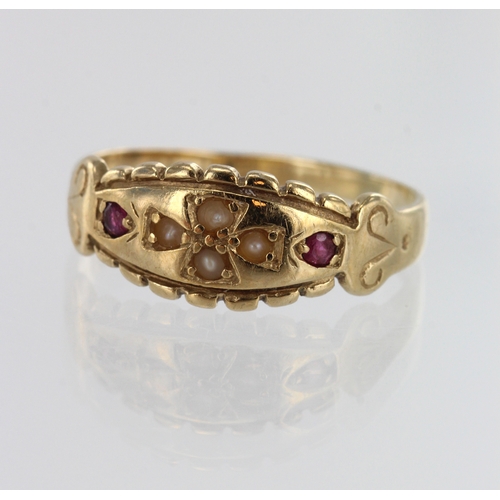 255 - Yellow gold (tests 9ct) antique ruby and seed pearl ring, four seed pearls and two rubies approx. 1.... 