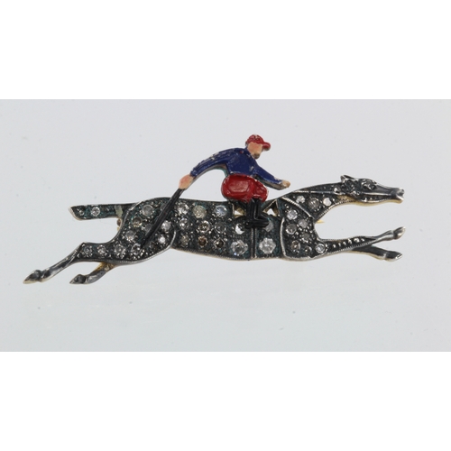 324 - Silver set with gold reverse antique horse and jockey brooch, horse set with diamonds, articulated e... 