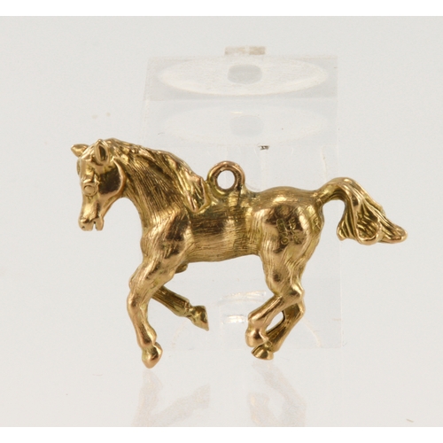 333 - 9ct yellow gold galloping horse pendant, measuring 35mm x 25mm, weight 8.9g.