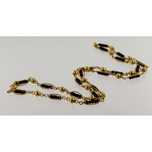 354 - Yellow gold (tests 18ct) black beaded fetter chain, ball links spaced inbetween oval rope links hold... 