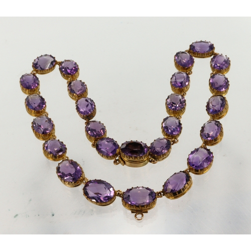 356 - Yellow metal (tests 9ct) antique amethyst riviere collarette necklace, set with twenty-six graduatin... 