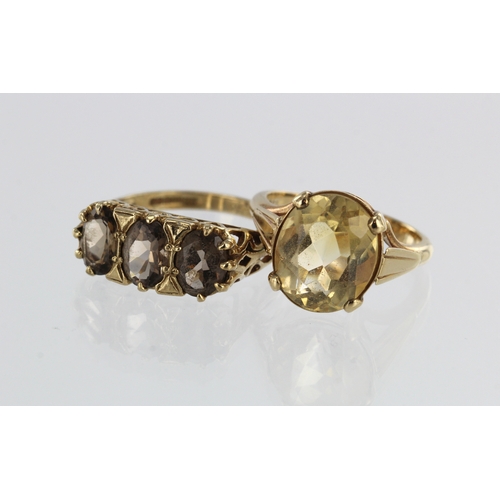 360 - Two 9ct gold/tests 9ct cocktails rings, stones include citrine and smokey quartz, finger size K/L, O... 