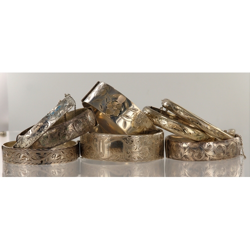 361 - Eight vintage silver hinged bangles, total weight 230.5g.