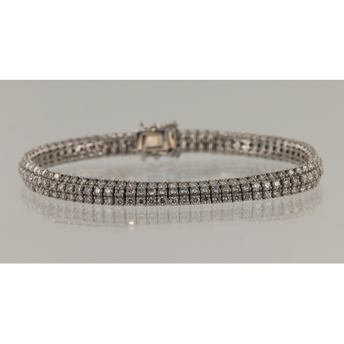 365 - White gold (tests 14ct) three row diamond set bracelet, TDW approx. 5.75ct, length 7