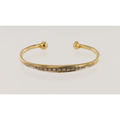 381 - Yellow gold (tests 9ct) diamond set torque bangle, thirteen graduating diamonds, TDW approx. 0.30ct,... 