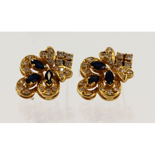 382 - Pair of yellow gold (tests 18ct) diamond and sapphire cluster stud earrings, each stud set with thre... 