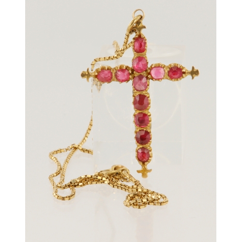 388 - Yellow gold (tests 18ct) ruby cross pendant and chain, eleven rubies approx. 3mm, pendant length 40m... 