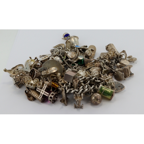 397 - Four silver/white metal charm bracelets, total weight 472.2g.