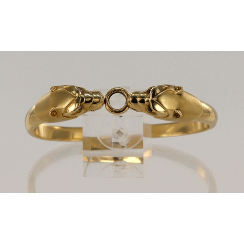 400 - Yellow gold (tests 14ct) double panther head bangle, set with diamond and sapphire eyes, hinged bang... 