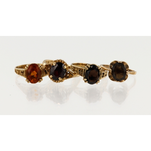 405 - Four 9ct yellow gold dress rings, stones include garnet, citrine, smoky quartz, finger sizes I/J, L,... 