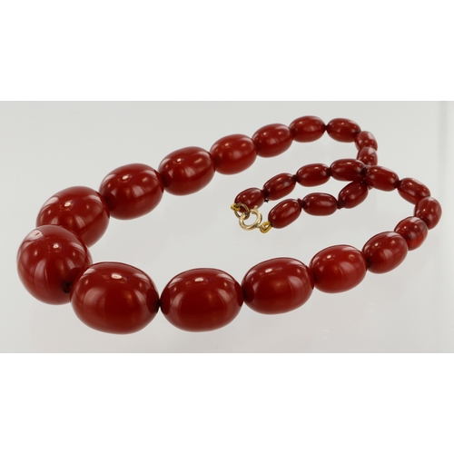 411 - Cherry red Bakelite single row beaded necklace, twenty-seven graduated beads, largest bead measures ... 