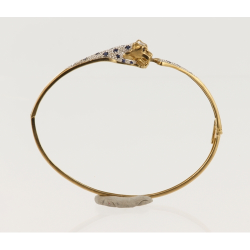 501 - 9ct yellow gold diamond and sapphire panther bangle, TDW approx. 0.10ct, hinged with boxed clasp, in... 