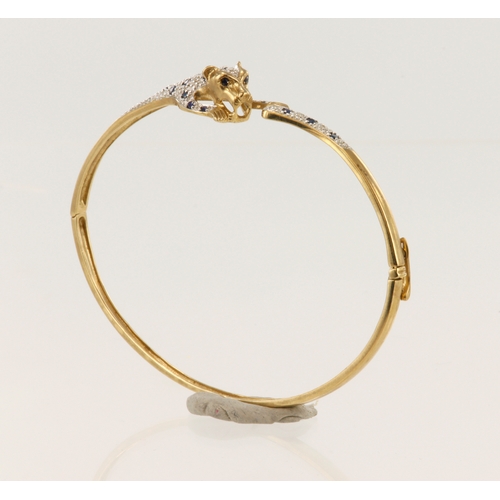 501 - 9ct yellow gold diamond and sapphire panther bangle, TDW approx. 0.10ct, hinged with boxed clasp, in... 