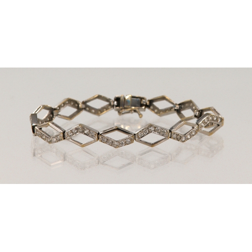 559 - White gold (tests 18ct) CZ set bracelet, length 6.5