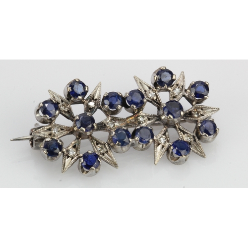 567 - White gold (tests 9ct) sapphire set brooch, fourteen round sapphires approx. 2.5mm each, length 31mm... 