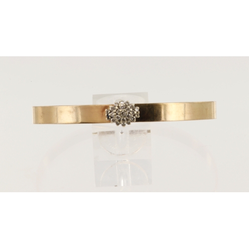 568 - Yellow gold (tests 9ct) solid bangle, set with a diamond cluster, TDW approx. 0.46ct, flat profile w... 