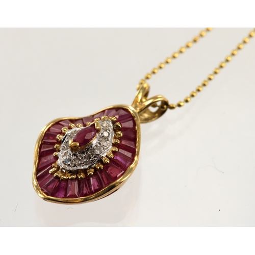 572 - 9ct yellow gold diamond and ruby set necklace, pendant set with one principle marquise ruby and a ou... 