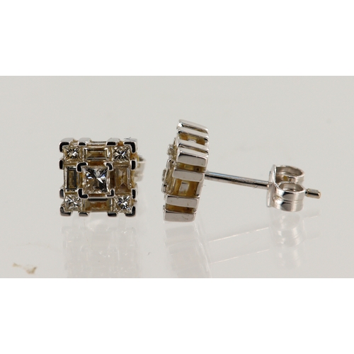 607 - 18ct white gold diamond cluster studs, each stud is set with five princess cuts and four baguette cu... 