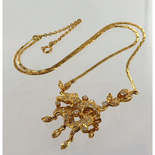 615 - Yellow gold (tests 18ct) diamond necklace, pendant pave diamond set with foliate details, TDW approx... 