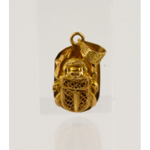 618 - Yellow gold (tests 18ct) Eygptian scarab beetle pendant, hieroglyphics on reverse, length 32mm, weig... 