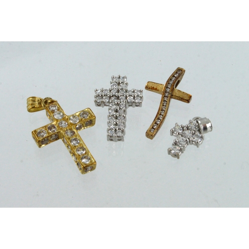 629 - Four 9ct gold CZ set cross pendants, total weight 7.3g.