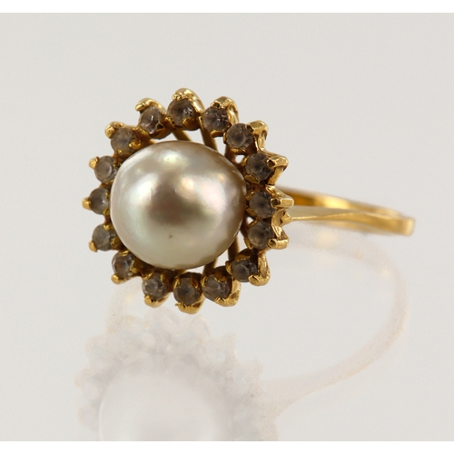 65 - Yellow gold (tests 18ct) cultured pearl cluster ring, pearl approx. 8mm, surrounded by paste stones,... 