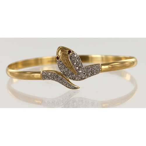 651 - 9ct yellow gold serpent bangle, head and tail set with CZ's and ruby eyes, inside diameter 60mm x 68... 