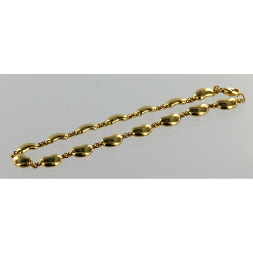 655 - Tiffany & Co. Tests 18ct yellow gold Elsa Peretti Bean design bracelet, length 7.5