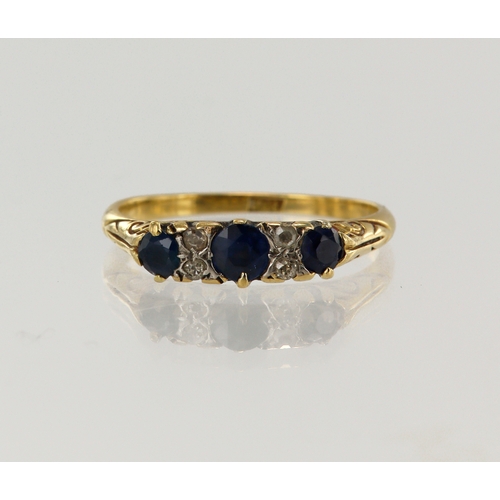 78 - Yellow gold (tests 18ct) diamond and sapphire ring, three graduating sapphires principle measures 4m... 