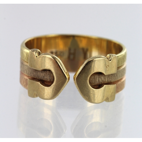 90 - Tri-coloured gold (tests 18ct) double-C ring, brushed finish with 'C' terminals, width 7mm, finger s... 