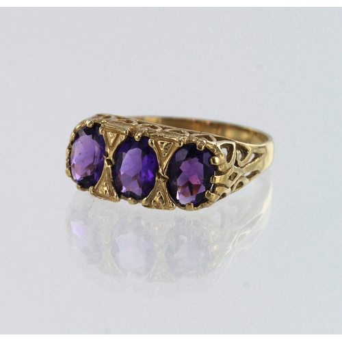 94 - 9ct yellow gold amtheyst trilogy ring, principle amethyst measures 7mm x 5mm, finger size Q, weight ... 