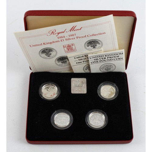 216 - One Pound Silver Proof four coin set 1984 - 1987. FDC in the red case of issued