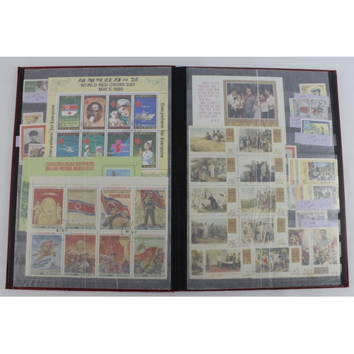 48 - North Korea: Stockbook of North Korean stamps - mostly anti-US messages. Mint & Used 100’s.